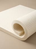 Latex Mattress Topper — close-up of the rolled, pinhole-ventilated natural latex